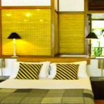 Blue water deluxe room bed view from the seaside